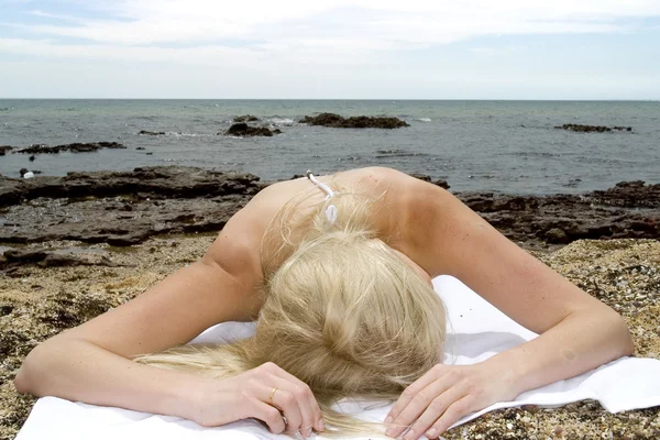 Model lying on  beach — Stock Photo, Image