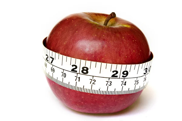 Apple с измерительной лентой — стоковое фото