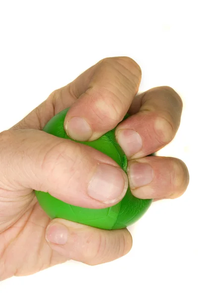 Man's hand squeezing ball. — Stock Photo, Image