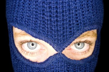 A stock photograph of an attractive woman wearing a balaclava. clipart