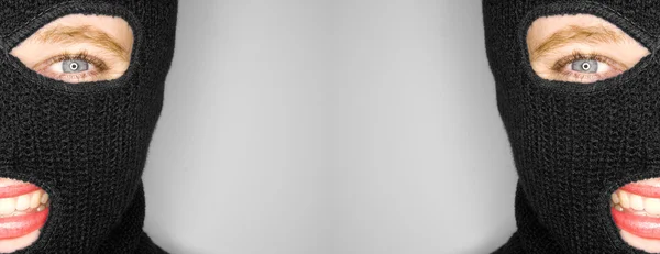 Een stock foto van een aantrekkelijke vrouw dragen een bivakmuts. — Stockfoto