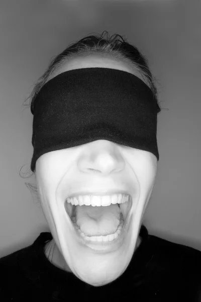 A stock photograph of a blindfolded woman.