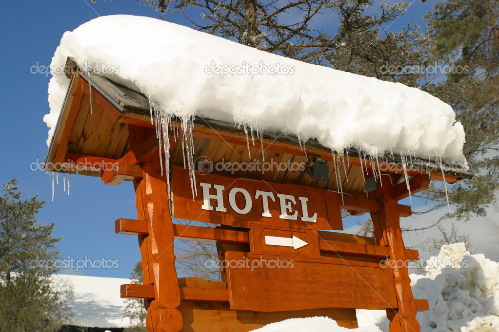 Hotel Sign covered in Ice and Snow