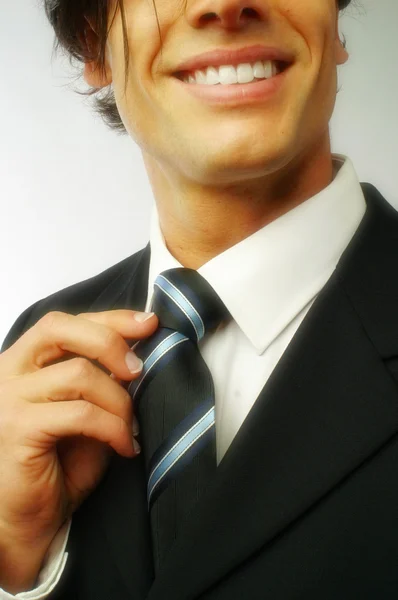 Man correcting tie — Stock Photo, Image