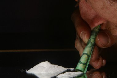 Person snorting cocaine clipart