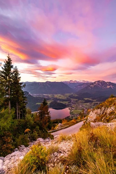 Magical sunrise from Loser-Panoramastrasse with vibrant autumn colours. View at rmorning to the austrian Alps Стоковое Фото