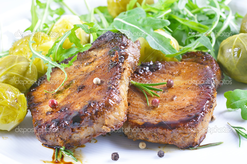 Grilled steaks and vegetables.