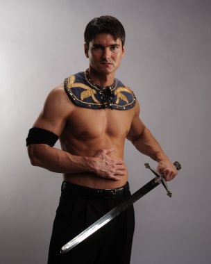 adam tutarak kılıç