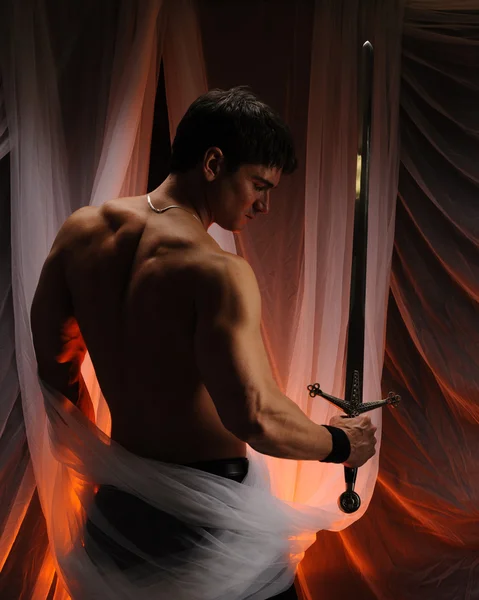 Man holding sword — Stock Photo, Image