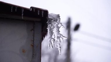 Icicles on roof,in winter icicles on roof melt, thaw in winter