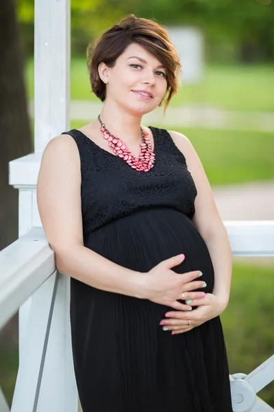 Happy pregnant woman in the summer forest — Stock Photo, Image