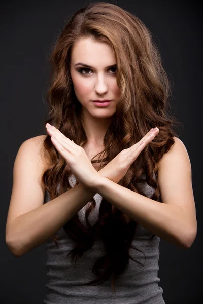 Beautiful girl crosses his arms over chest — Stock Photo, Image