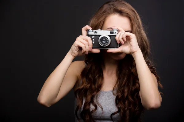 Beautiful girl with a camera — Stock Photo, Image