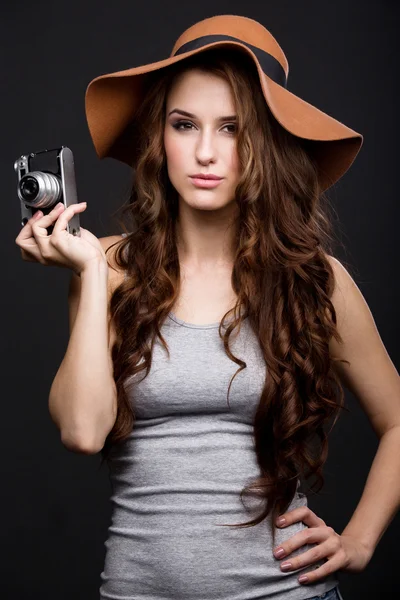 Beautiful girl with a camera — Stock Photo, Image