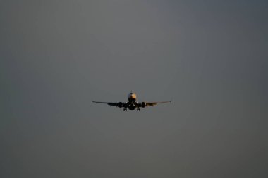 10-05-2021 Riga, Latvia Silhouette of a passenger plane taking off from the airport.