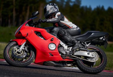 11-05-2020 Riga, Latvia Motorcyclist at sport bike rides by empty asphalt road. sport bike. MotoGP race. Superbikes. Motorbikes racing