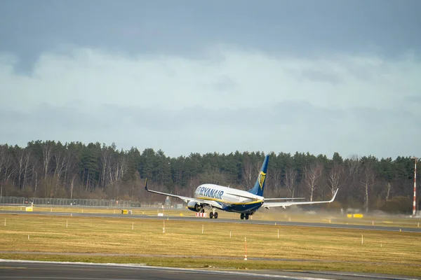 15-01-2022 Riga, Latvia White Passenger plane fly up over take-off runway from airport