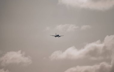 15-01-2022 Riga, Latvia White Passenger plane fly up over take-off runway from airport