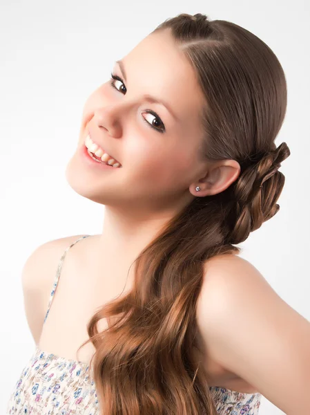 The beautiful young girl with a long fair hair posing  in studio Royalty Free Stock Photos