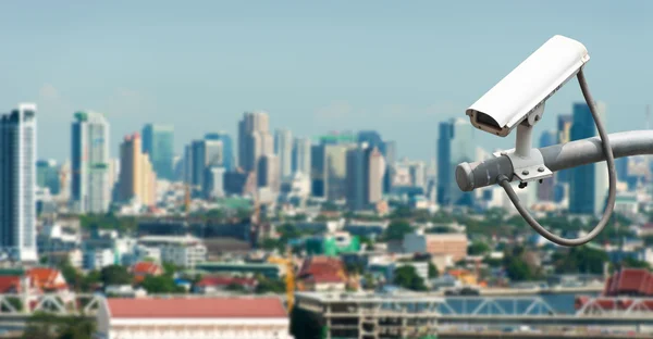 CCTV or surveillance operating with city in background — Stock Photo, Image