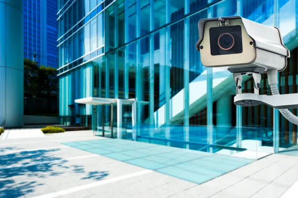 CCTV Camera or surveillance orperating with city building in bac — Stock Photo, Image