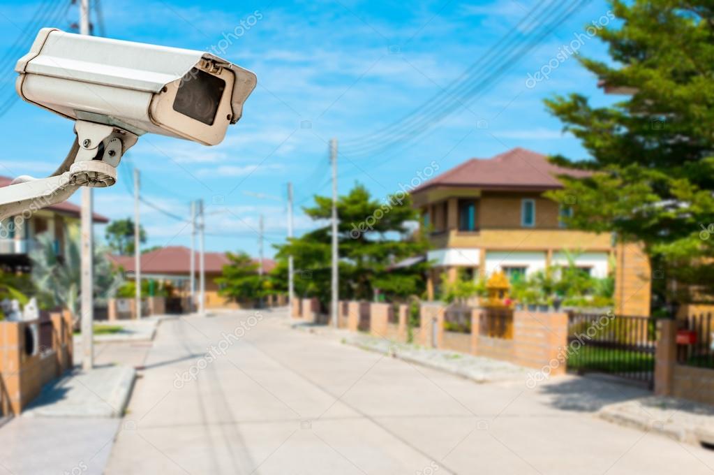 CCTV Camera with house and village in background — Stock Photo