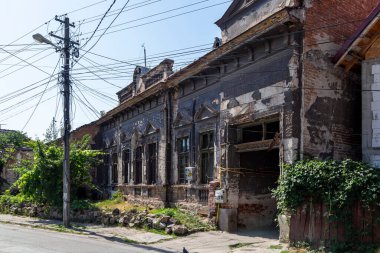 Hunedoara, Hunedoara County - July 22, 2022:  Old buildings in the old area of the city Hunedoara, Transylvania, Romania. 