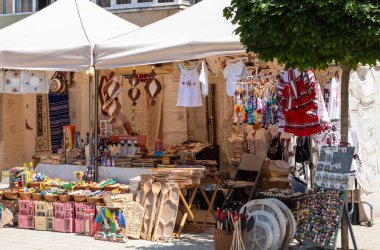 Hunedoara, Hunedoara County - July 22, 2022:  Market stall kiosk selling souvenirs in Hunedoara, Transylvania, Romania.