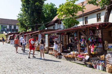 Hunedoara, Hunedoara County - July 22, 2022:  Market stall kiosk selling souvenirs in Hunedoara, Transylvania, Romania.