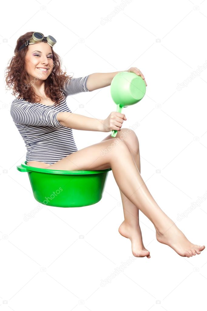 Girl sitting in a basin rides.