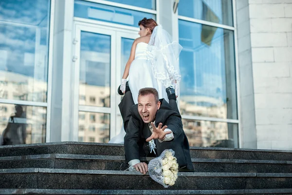 Bride makes groom to marry. — Stock Photo, Image