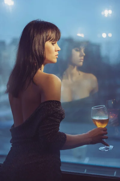 Beautiful Woman Glass Wine Stands Evening Window Woman Shoulders Open — Stock Photo, Image