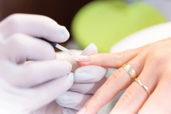 Woman Receiving Nail Procedure Beauty Salon — стоковое фото