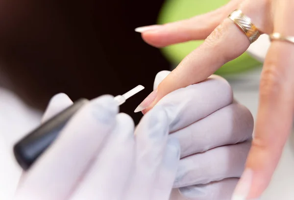 Woman Hands Receiving Nail Procedure Beauty Salon — стоковое фото
