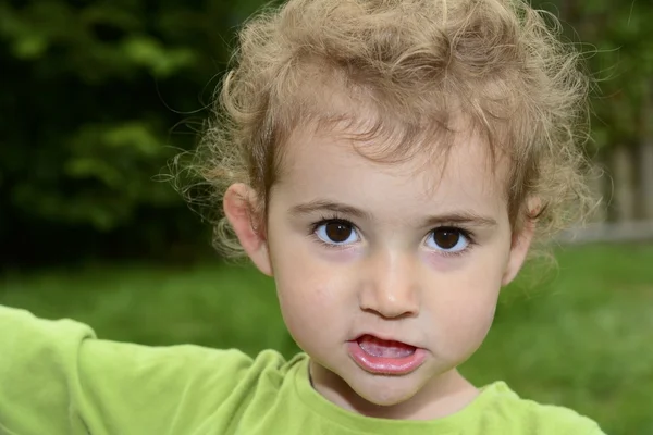Young girl sneering. Royalty Free Stock Photos