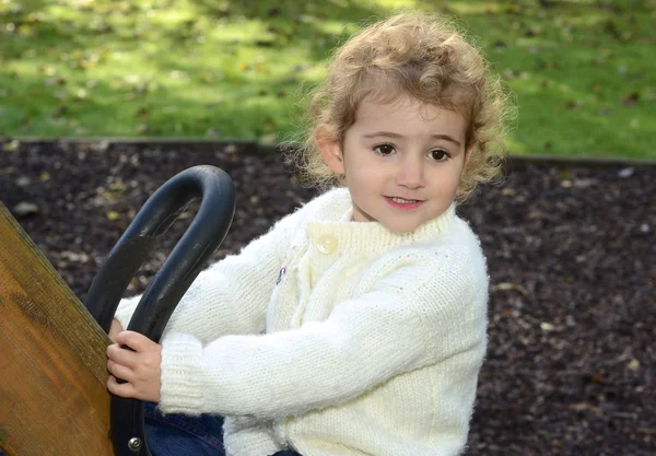 Young child having fun playing outside — Stock Photo, Image