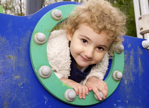 Young child playing at the playground Stock Picture