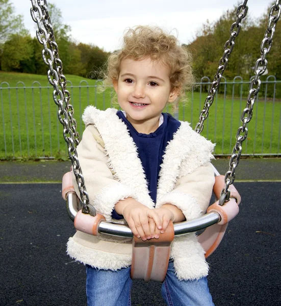 Young child on a swing Stock Photo