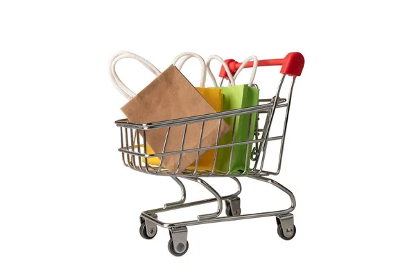 Shopping cart with packages of products and goods. Online sales and purchases. — 图库照片