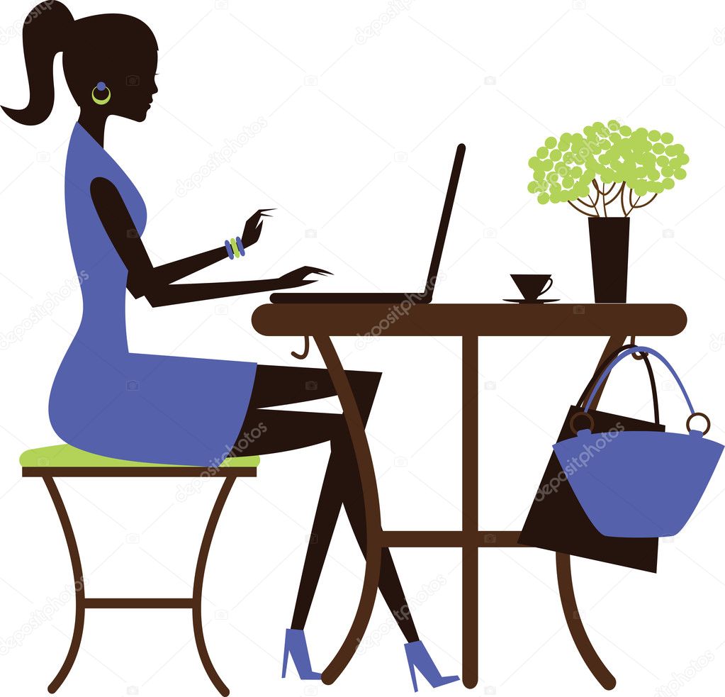 Woman with laptop in the cafe.