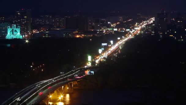 Cars moving across river bridge lights — Stock Video