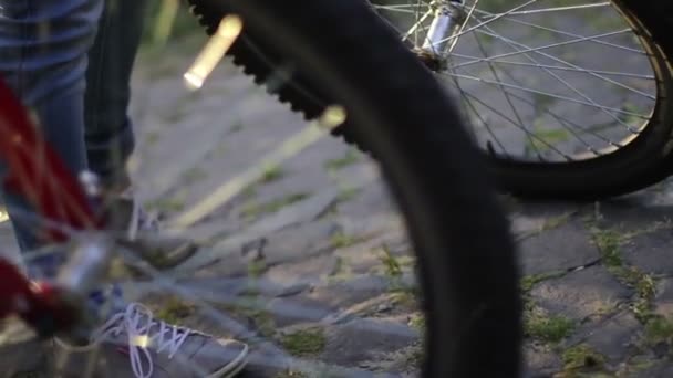 Young couple rides two bicycles — Stock Video