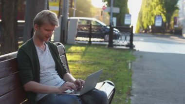 Male types on laptop