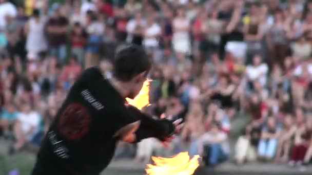 Artist with chained fire pois — Stock Video