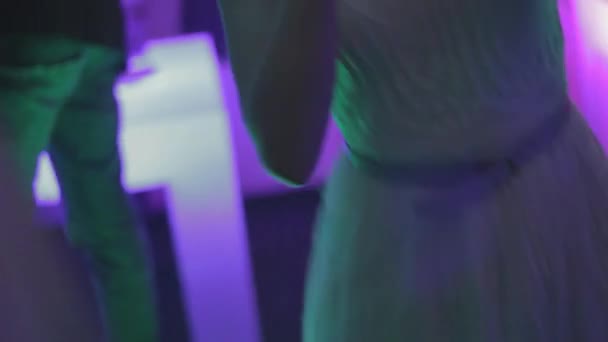 Girl in white dress is dancing in club — Stock Video