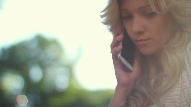 Young adult woman dials calls — Stock Video