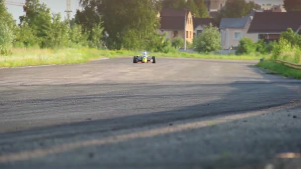 Two f1 race cars driving at low speed — Stock Video