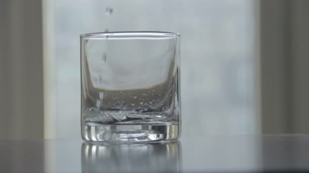 Pouring water glass of clean water — Stock Video