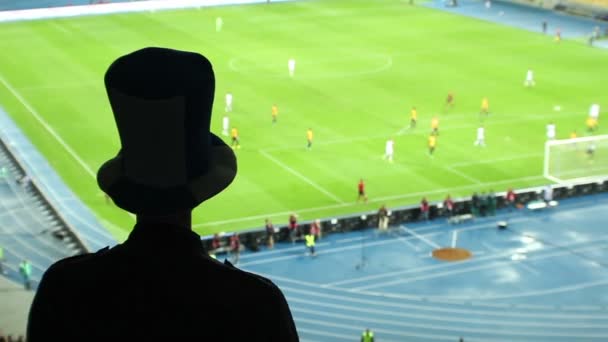 Football fan in high cylinder hat — Stock Video