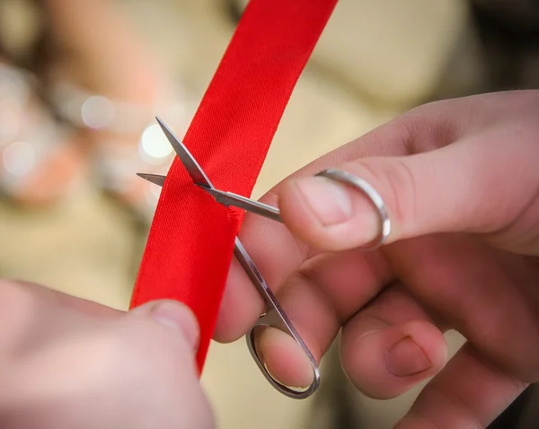 Cutting red ribbon — Stock Photo, Image